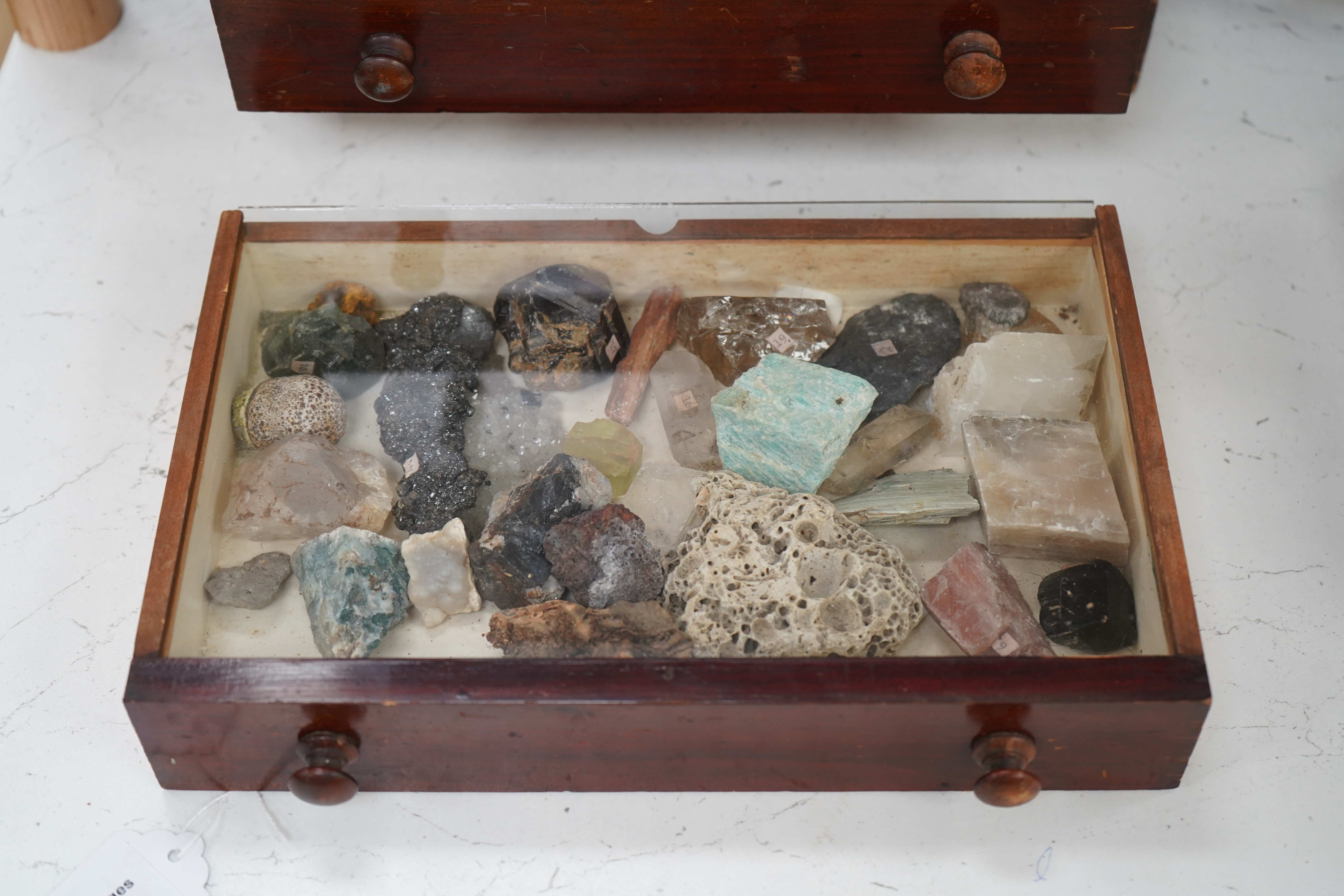 An early 20th century collector’s chest fitted with five drawers filled with mineral specimens and butterflies to include Haematite, Scorodite and Pyrite, 30cm high. Condition - fair